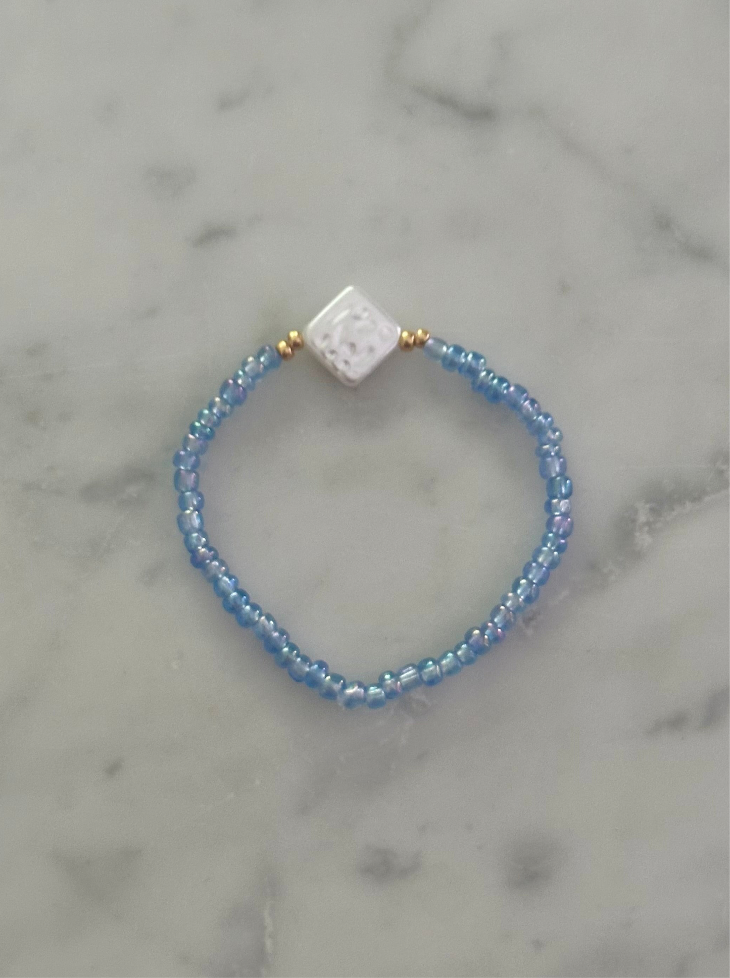 blue shiny and pearl bracelet