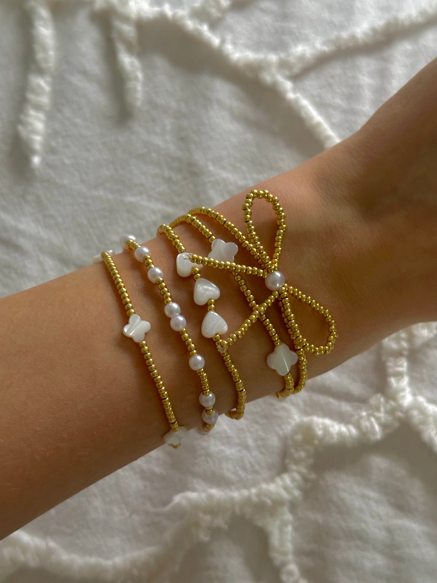 gold beaded bow bracelet