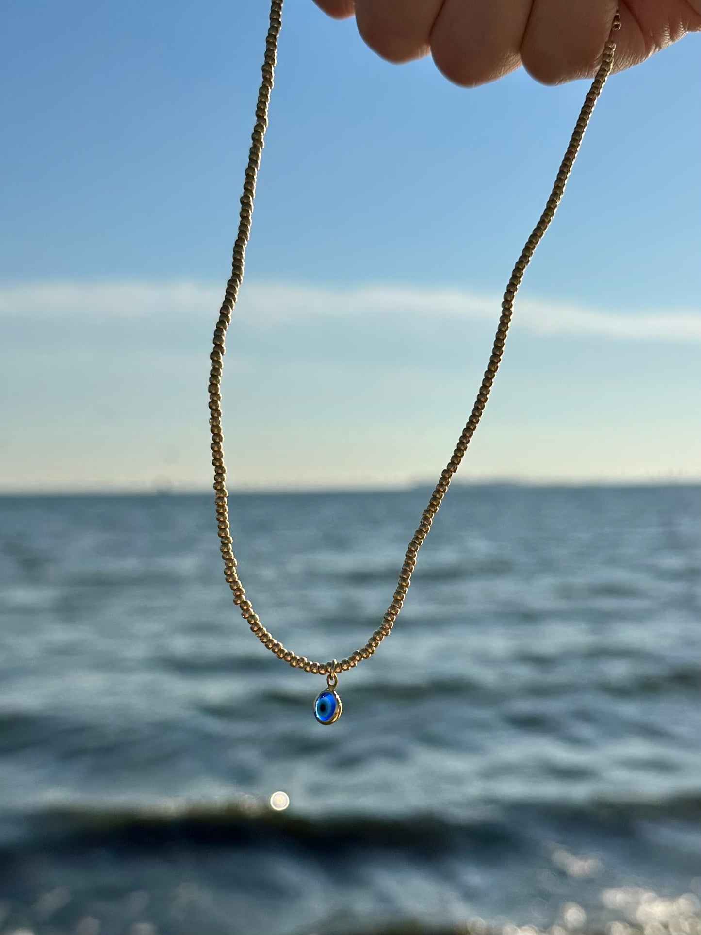 gold evil eye beaded necklace