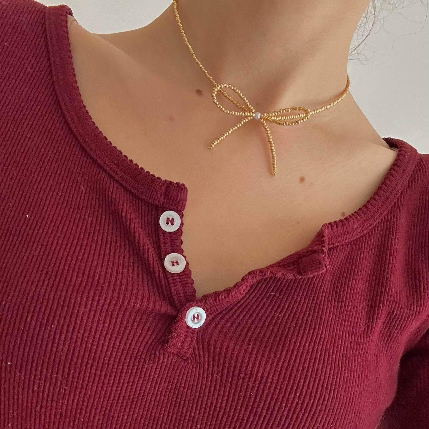 beaded gold bow necklace