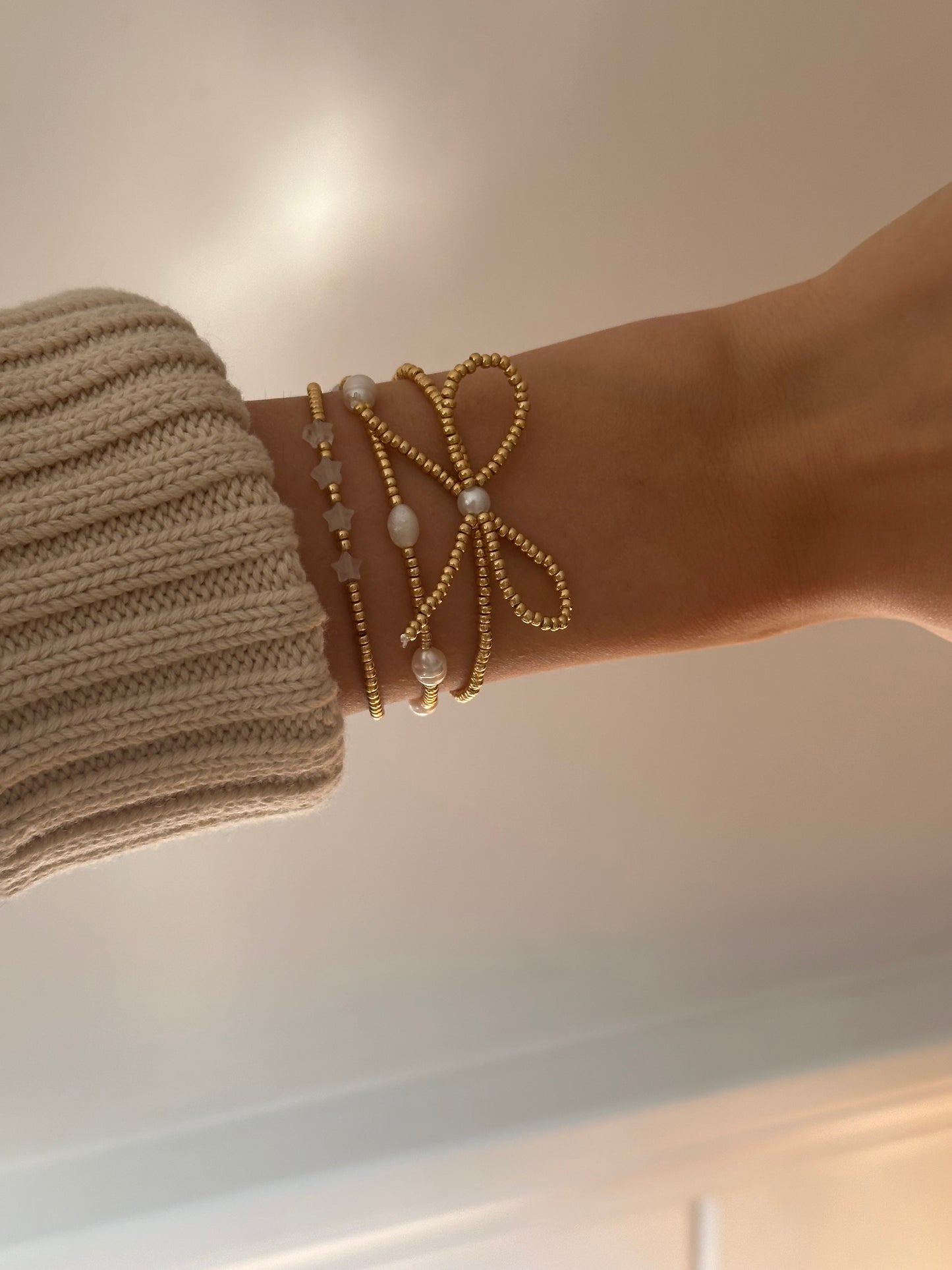 gold beaded bow bracelet