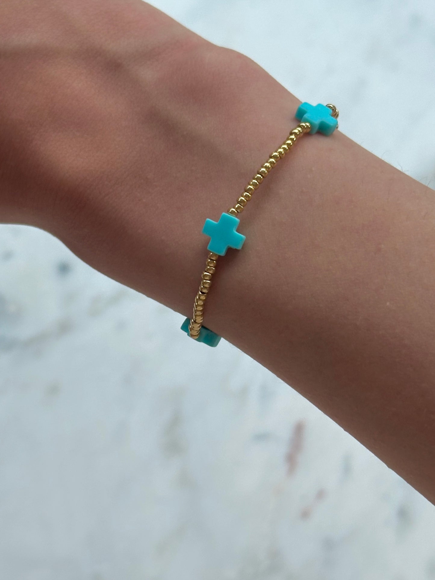 blue cross bead bracelet