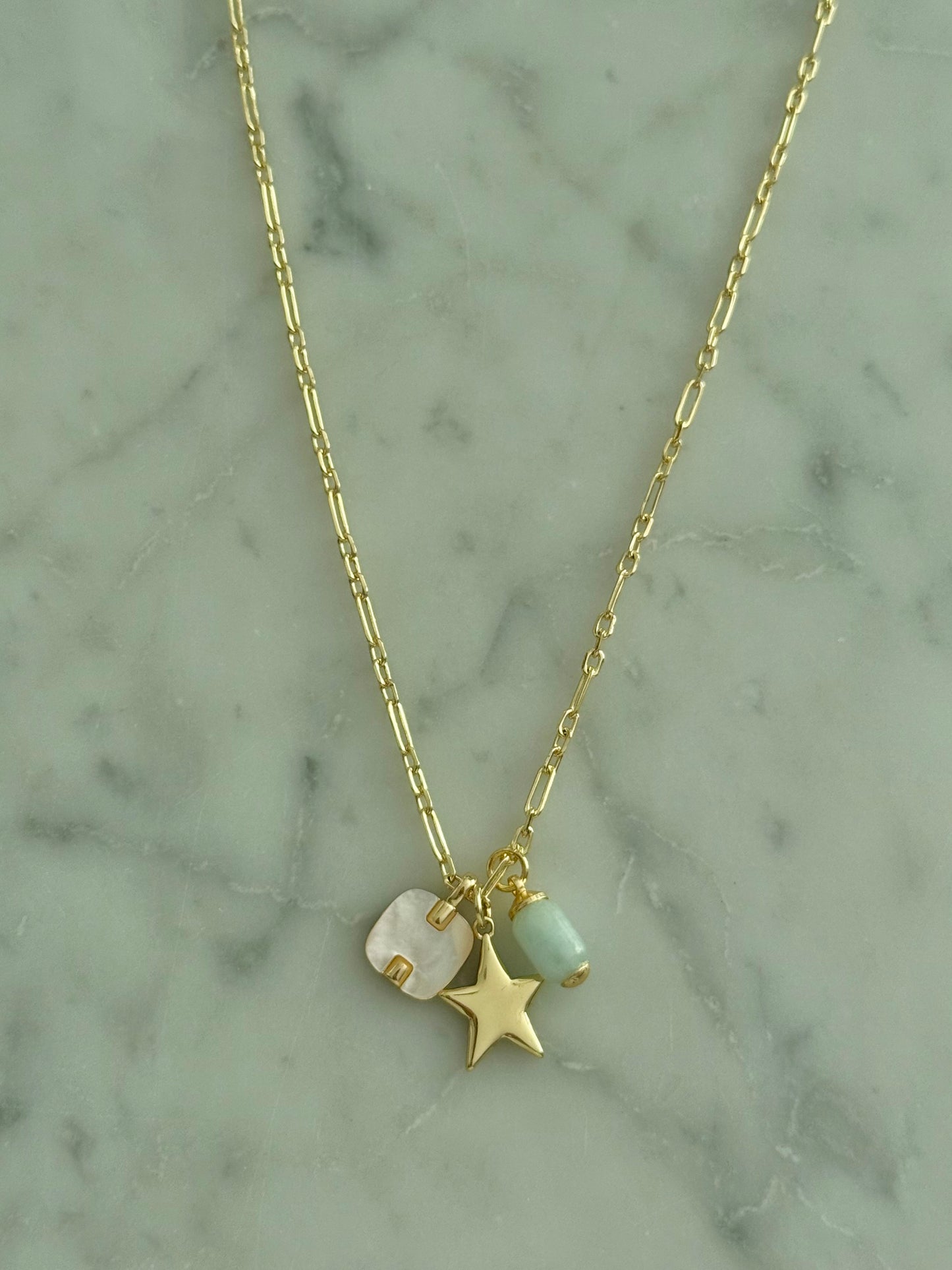 star, mother of pearl, and stone multi-charm gold filled necklace