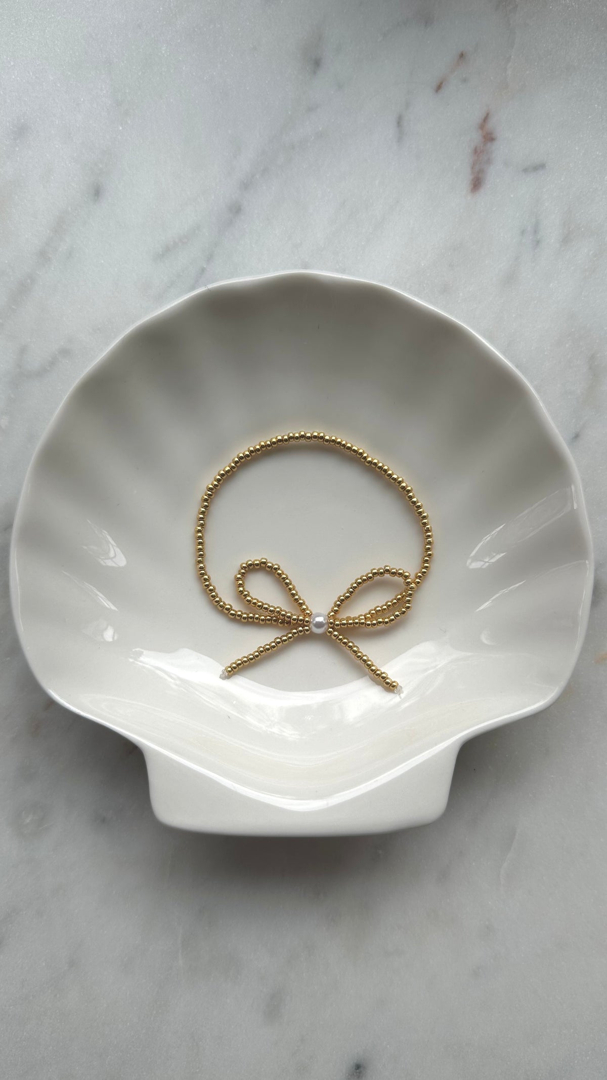 gold beaded bow bracelet – ivory moon