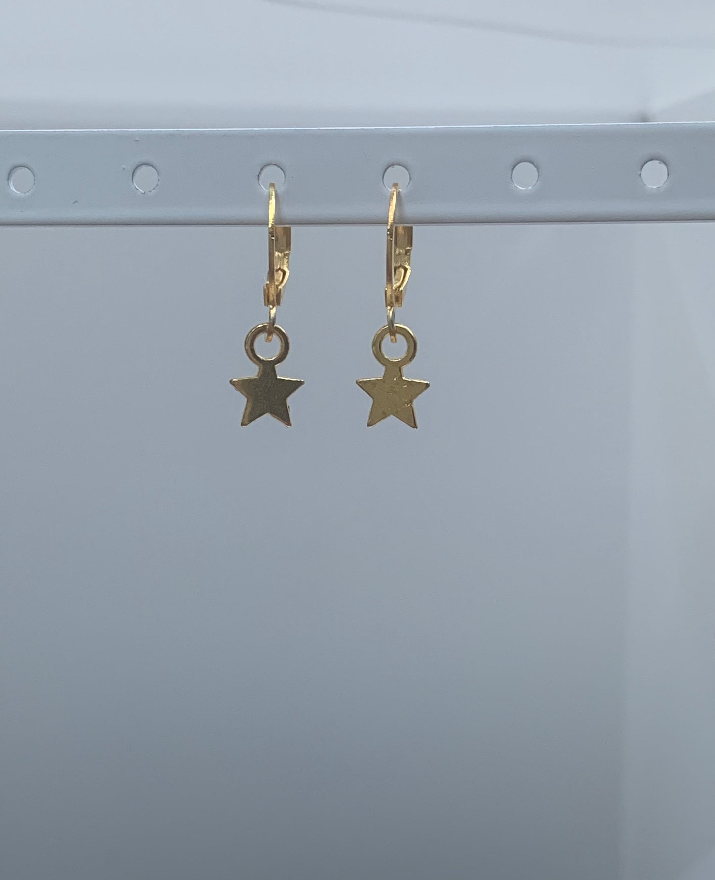 star huggie earrings